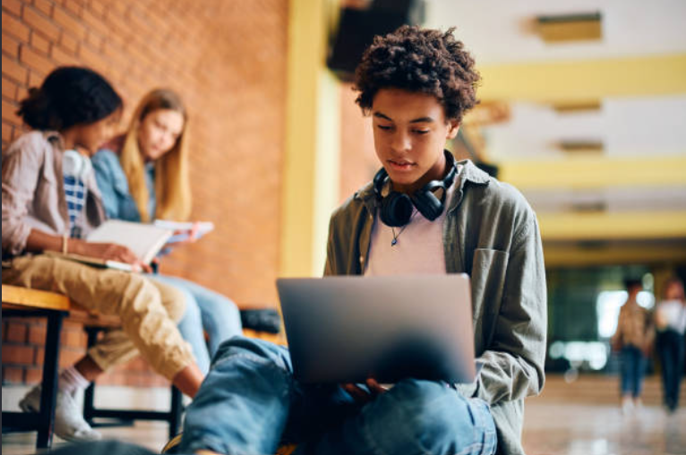 Secondary student learning with a laptop