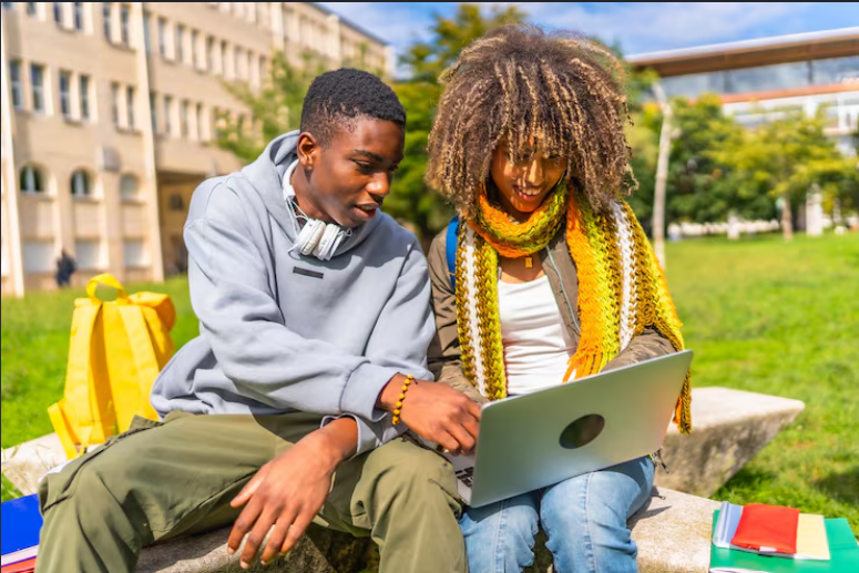 African university students using a laptop together