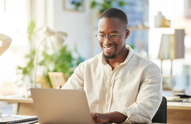 African working adult using a laptop